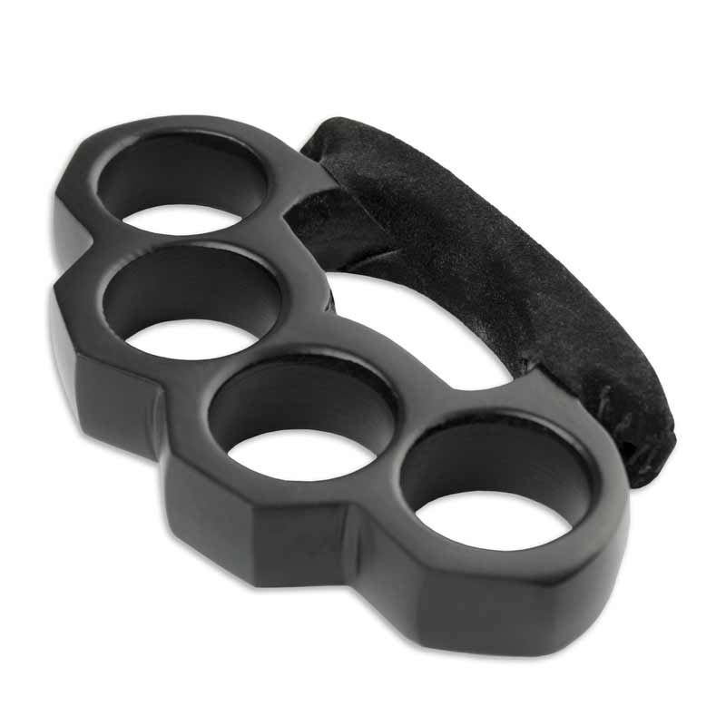 Brass knuckles on black stone background, closeup Stock Photo