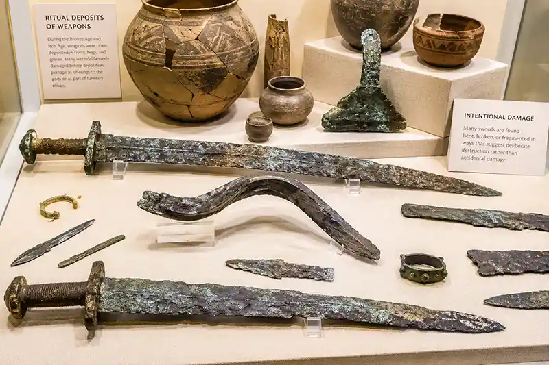 Ancient swords deliberately bent and broken in archaeological display