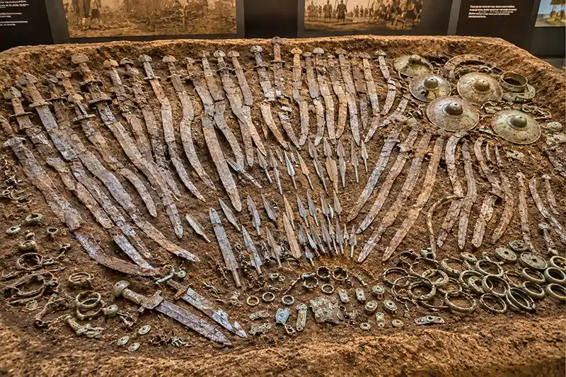 Large archaeological deposit of deliberately damaged ancient weapons