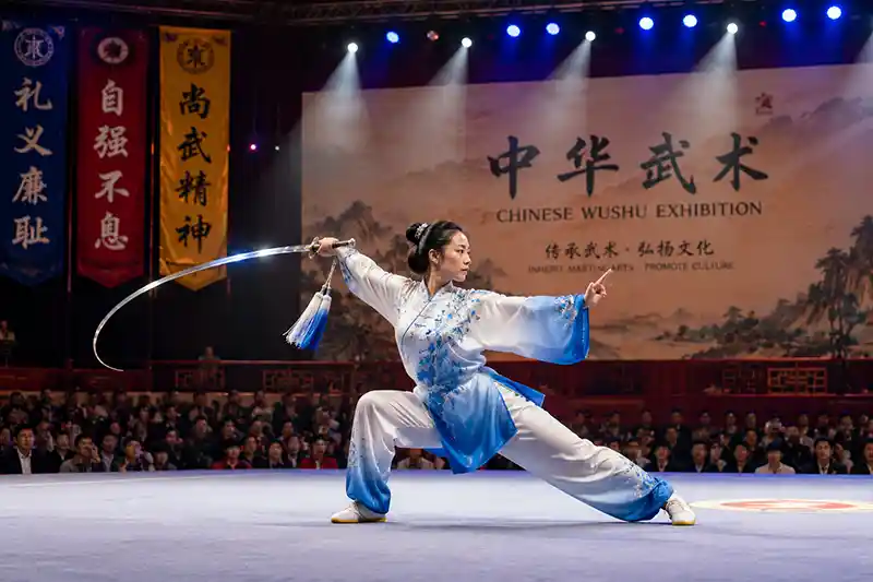 Wushu performer demonstrating a flexible Chinese sword on stage